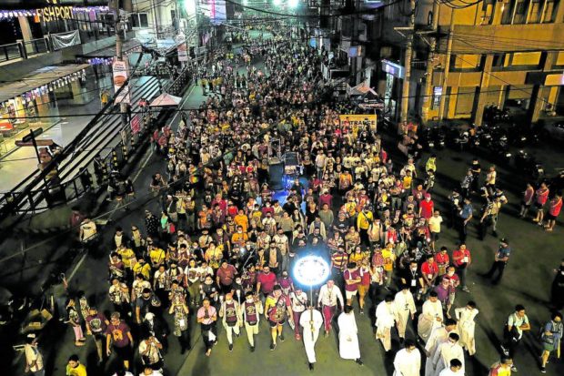 PROCESSION BEFORE DAWN Thousands of Black Nazarene devotees arrive in Quiapo after a “Walk of Faith” from Quirino Grandstand in the wee hours of Sunday. —RICHARD A. REYES