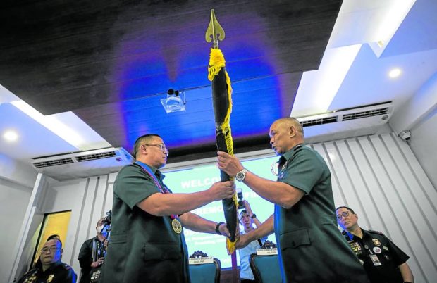 NEW LEADER  Brig. Gen. Romeo Caramat Jr. (right) assumes leadership of the Philippine National Police Criminal Investigation and Detection Group during a ceremony led by PNP chief Gen. Rodolfo Azurin Jr. on Monday. —LYN RILLON