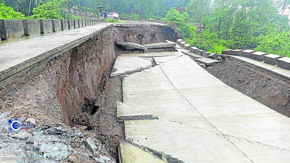 A portion of C3 road in Iligan City is damaged by a landslide due to incessant rains on Thursday, rendering it impassable to all types of vehicles. 