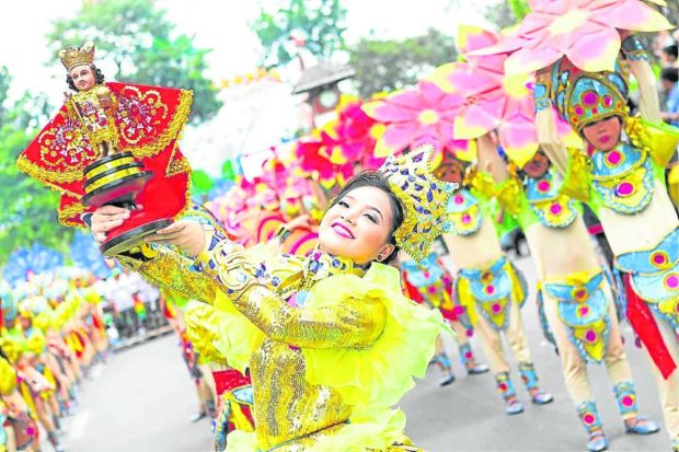 Cebu studentsparticipate in the 2020 staging of Sinulog Grand Parade, the highlight of the 10- day festivities to honor the Holy Child Jesus