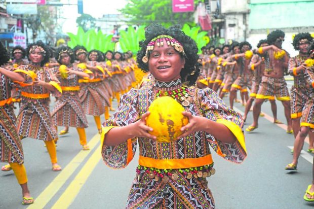 A contingent from one of Misamis Oriental’s local governments performs during the street dancing competition of Kuyamis Festival staged in Cagayan de Oro City on Friday. STORY: Coconut festival unites Cagayan de Oro, Misamis Oriental leaders