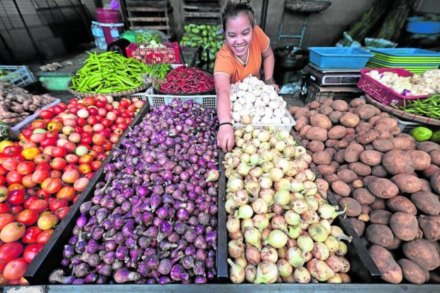 Market vendor selling onions at the Marikina Public Market. STORY: Quimbo suspects cartels behind ‘artificial’ onion prices