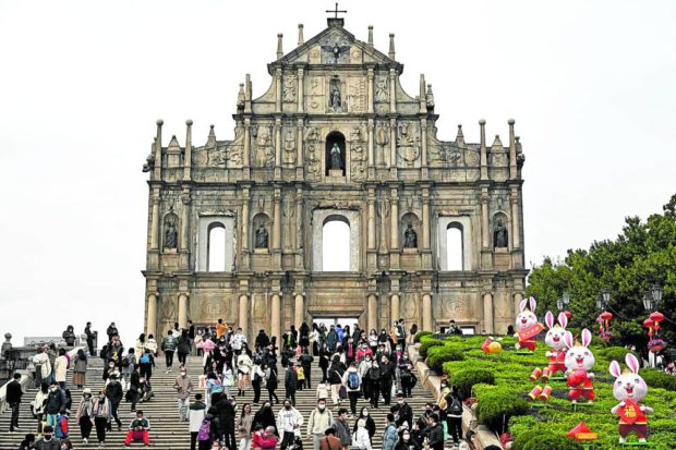 Visitors from mainland China flock to the Ruins of Saint Paul’s in the southern Chinese enclave of Macau in this photo taken on Jan. 17, 2023. STORY: Tourists back but it’s not business as usual in Macau