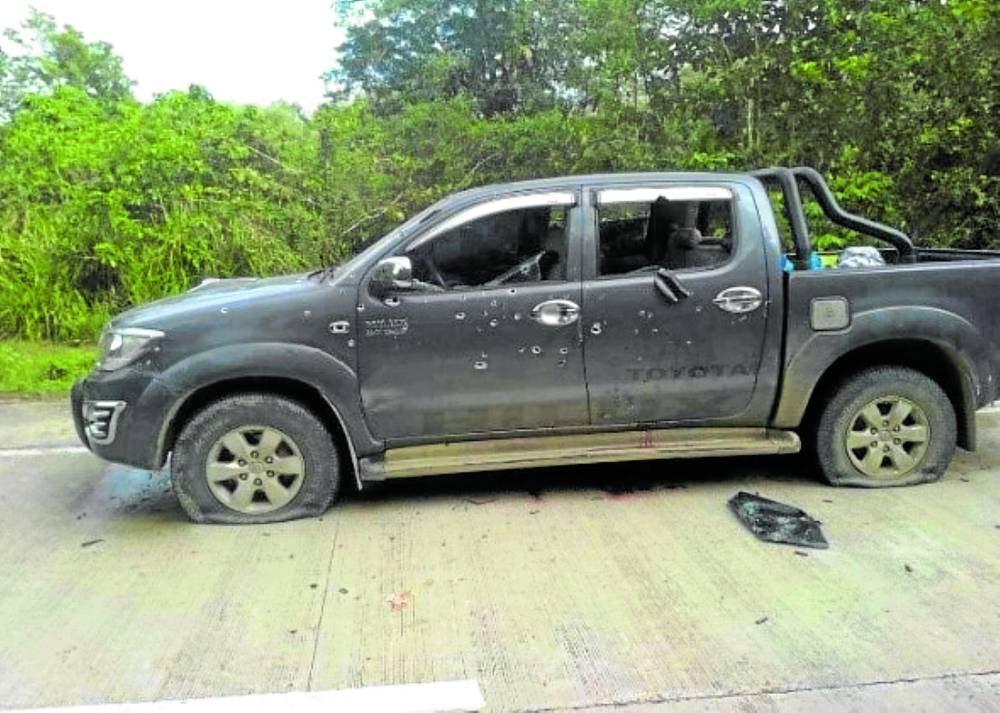 he vehicle of Alih Manangca, the slain village chief of Balubuan, Sirawai, Zamboanga del Norte, is riddled with bullets and is left on the road for police inspection on Thursday