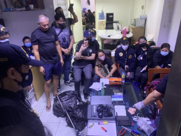 Agents from the National Capital Region Police Office and the Bureau of Immigration confiscate mobile phones, laptops, cigarettes and other prohibited items inside the detention facility for foreigners in Camp Bagong Diwa in Taguig City on Tuesday, January 31, 2023. Photo credit/National Capital Region Police Office