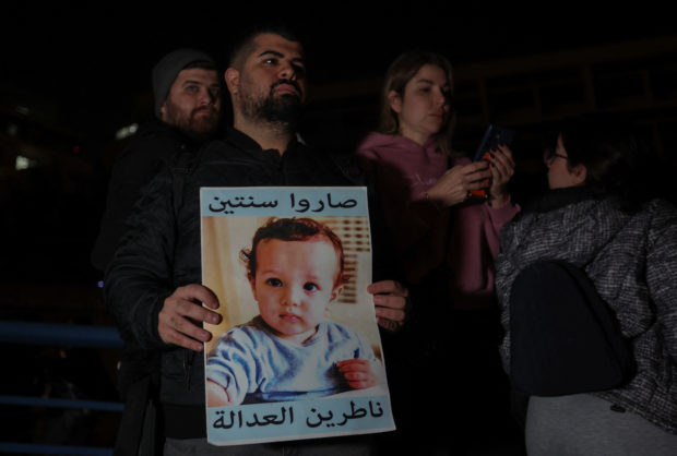 Families of the victims of the 2020 Beirut port explosion gather during a protest