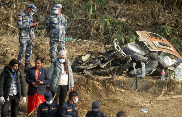 Nepali rescue workers scoured a debris-strewn ravine Monday for three missing bodies from the mangled wreckage of a plane that crashed with 72 people on board, with hopes of any survivors now "nil," according to authorities.