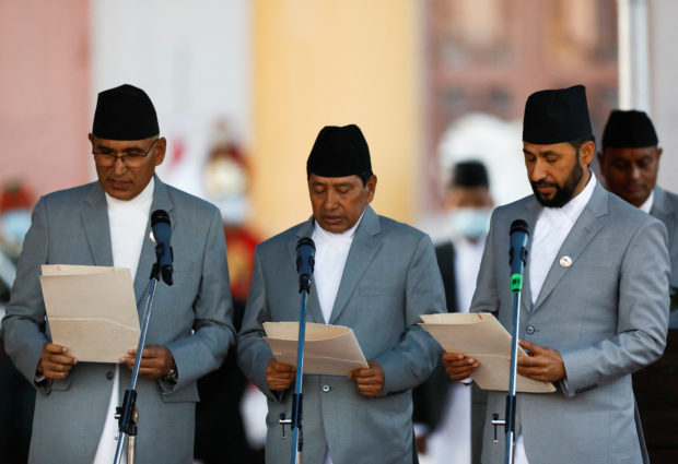 Newly elected Prime Minister Pushpa Kamal Dahal administers the oath of office at the presidential building in Kathmandu
