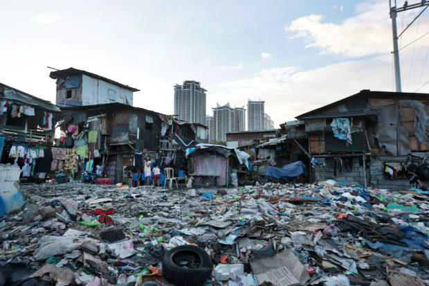 Around the glitzy business districts of MetroManila are poor neighborhoods, like this community in Makati City’s Guadalupe district, where families face the daily struggle of putting food on their tables. STORY: Oxfam wants policies to bust the 'super-rich'