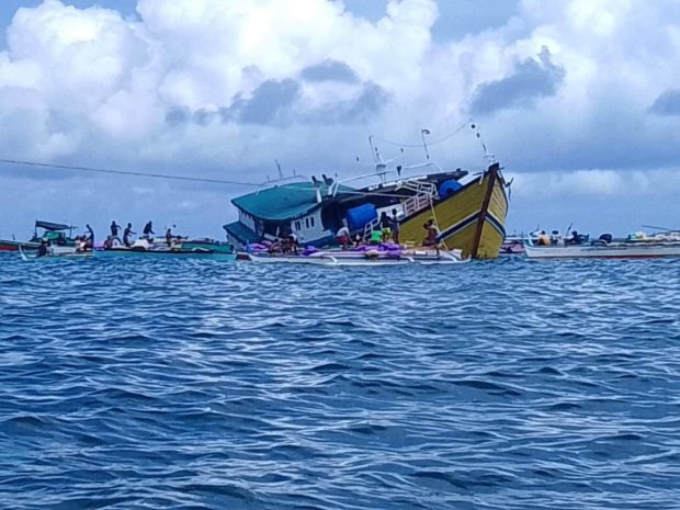 At least 10 people were rescued after a cargo vessel half-submerged in Sulu, the Philippine Coast Guard said in a statement on Tuesday.