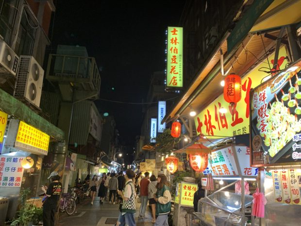Taiwan residents and visitors enjoy the night scene in Taipei amid lingering threats from China.
