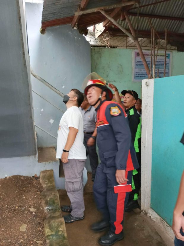 Masbate City officials inspect the damage following the magnitude 6 earthquake on Thursday, February 16, 2023. 