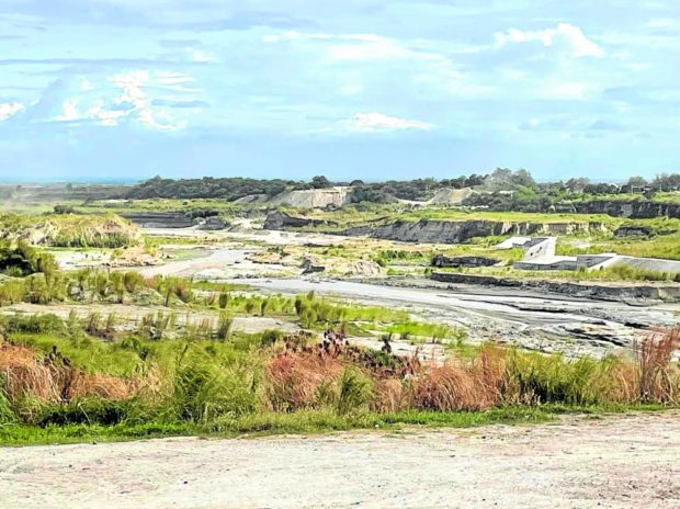 SOURCE   Quarrying of sand is usually done in the middle reaches of Mancatian River in Porac, Pampanga, as seen in this photo taken on Tuesday. —TONETTE T. OREJAS