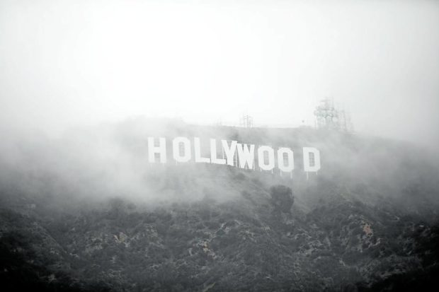 The Hollywood sign is seen through a mix of fog and dust snow during a rare cold winter storm in the Los Angeles area on Feb. 24. STORY: Snow over Hollywood: Rare winter storm becomes source of delight