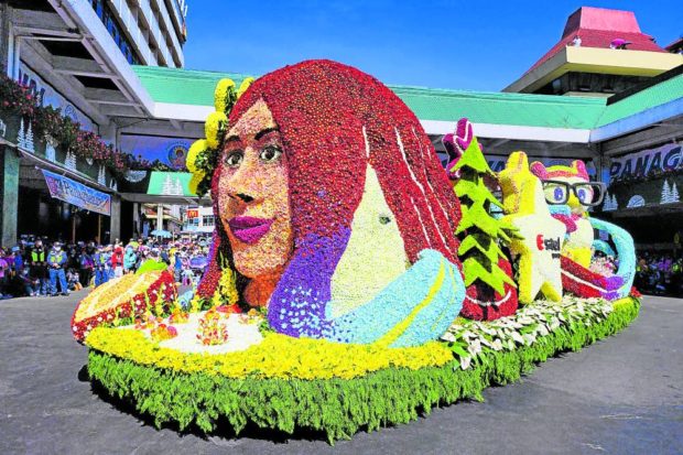 IN FULL BLOOM Information technology giant Sitel presents its float of flowers depicting a woman’s face at the Grand Float Parade on Sunday, the conclusion of Baguio City’s Panagbenga Flower Festival which has been revived after more than two years of the pandemic. —WILLIE LOMIBAO