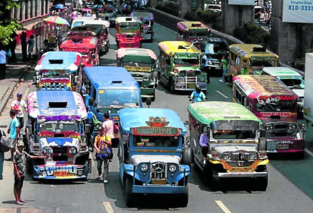 ‘KING OF THE ROAD’ NO MORE Traditional jeepneys ply along Aurora Boulevard in Cubao, Quezon City, in this 2017 photo. The government has pushed for the modernization of public utility vehicles, leading to the phaseout of the jeepney, the so-called “king of Philippine roads.” —RICHARD A. REYES