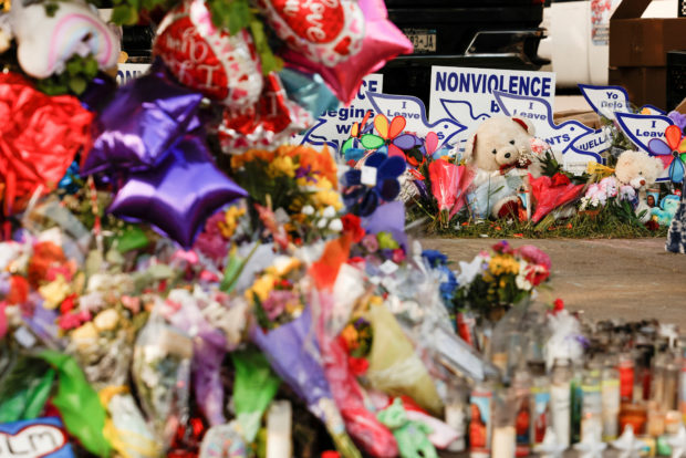 FILE PHOTO: A memorial at the scene of a weekend shooting at a Tops supermarket in Buffalo, New York