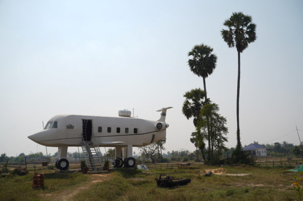 Cambodian man builds 'airplane house'