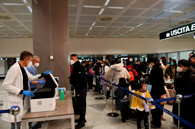 FILE PHOTO: Italy imposes mandatory COVID-19 tests for travellers from China