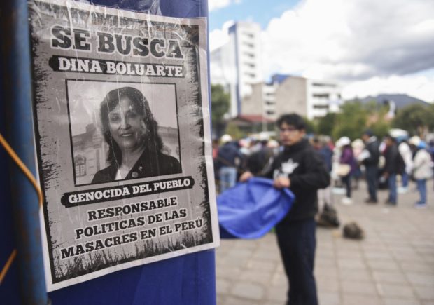 A poster depicting Peruvian President Dina Boluarte is seen at a camping ground of opposers of Boluarte, with soup kitchens at the Tupac Amaru square in Cusco, Peru on February 1, 2023. - The Peruvian Congress resumed debate on bringing forward elections for this year in a bid to end weeks of deadly protests that have brought parts of the country to a standstill, after recent failed attempts to agree on a plan to do so. (Photo by Ivan FLORES / AFP)