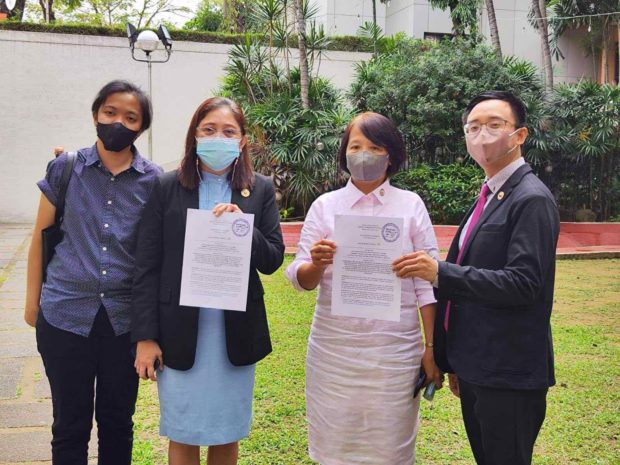 Three members of the House of Representatives' Makabayan bloc are pushing to drop all the charges against Tacloban-based journalist Frenchie Mae Cumpio and four activists, calling for an end to the "weaponization of the law to stifle press freedom."