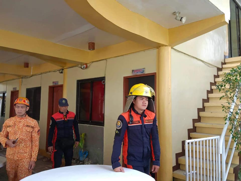 Emergencyresponders and disaster response officials assess the structural integrity of buildings and other structures in Masbate City on Friday following the magnitude 6 earthquake that struck Masbate