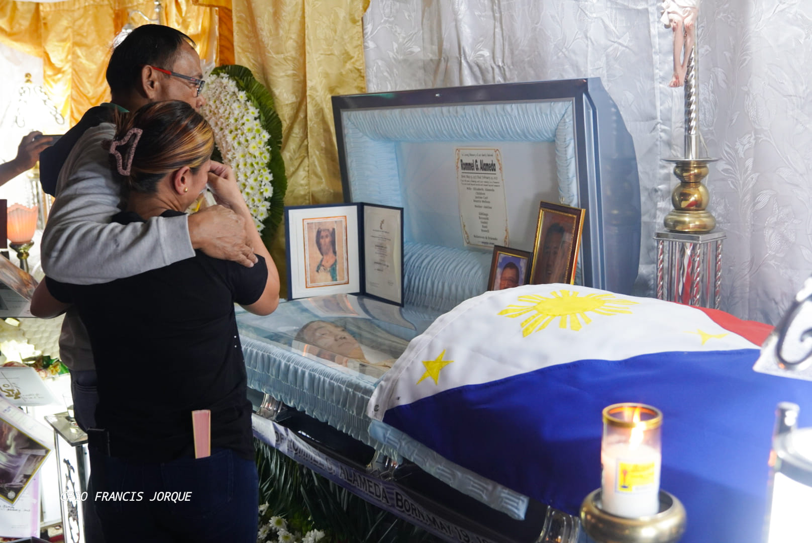 Elizabeth Alameda, the widow of the late Aparri Vice Mayor Rommel Alameda, is being comforted by Cagayan Gov. Manuel Mamba during the wake of the slain official