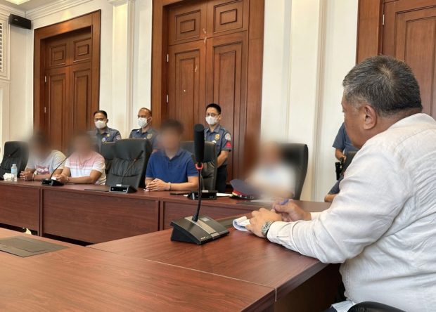 CAPTION: Justice Secretary Jesus Crispin Remulla met the three policemen involved in the death of Spanish national Diego LaFuente.