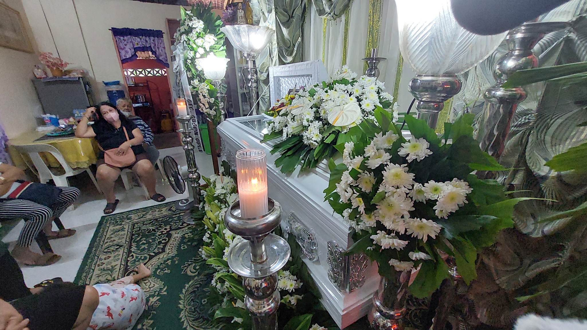 The body of Wilma Tezcan, an earthquake victim in Turkey, lies in state at the family home in Lucena City