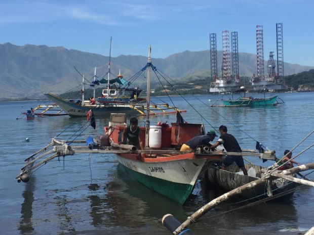 Fishermen in Zambales province prepare their fishing boat in this coastal village of Subic city
