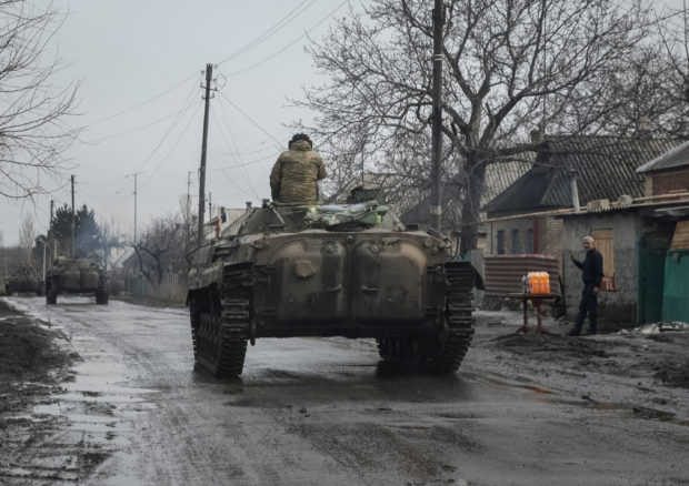 Ukrainian service members ride BMP-2 infantry fighting vehicles, as Russia's attack on Ukraine continues, near the frontline city of Bakhmut, Ukraine February 27, 2023. REUTERS/Yevhen Titov