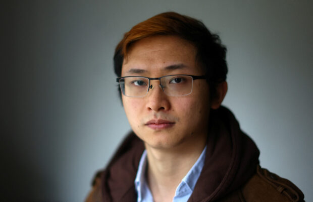 Junior Doctor Poh Wang poses for a photograph at his home in London. STORY: Britain’s junior doctors prepare to strike over pay, burnout