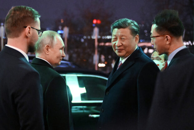 Russian President Vladimir Putin and Chinese President Xi Jinping leave after a reception in honor of the Chinese leader's visit to Moscow, at the Kremlin in Moscow, Russia March 21, 2023. Sputnik/Grigory Sysoev/Kremlin via REUTERS
