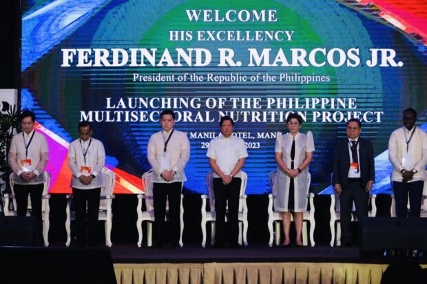 President Ferdinand Marcos Jr (center), Social Welfare Chief Rex Gatchalian (center left), and Health Officer-in-Charge Maria Rosario Vergreire (center right) along with other officials launch the Philippine Multisectoral Nutrition Project in the Manila Hotel on Wednesday, March 29, 2023. 