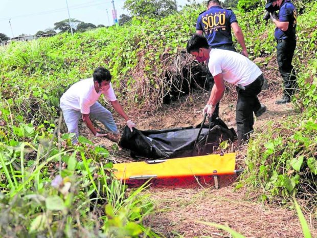 Police officer recover body of John Matthew Salilig in Cavite. STORY: 17 face raps in Adamson student’s hazing death