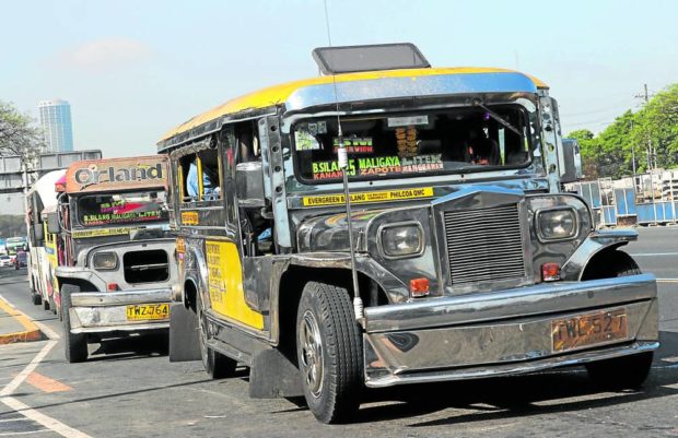 Jeepneys wait for passengers on Commonwealth Avenue, Quezon City on March 1, 2023 STORY: As strike looms, gov’t moves jeepney franchise deadline