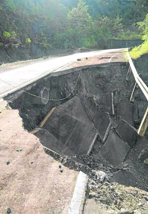 A portion of the national highway that links the towns of New Bataan and Maragusan in Davao de Oro collapses after strong earthquakes rocked the province at dawn on Monday. STORY: Two strong quakes in Davao de Oro damage highway, houses