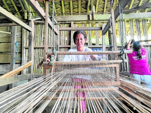 Without the aid of modern machines, residents in a coastal village in Sto. Domingo, Albay, weave abaca fibers to make fashion bags. STORY: In Albay, women find lifeline in abaca weaving