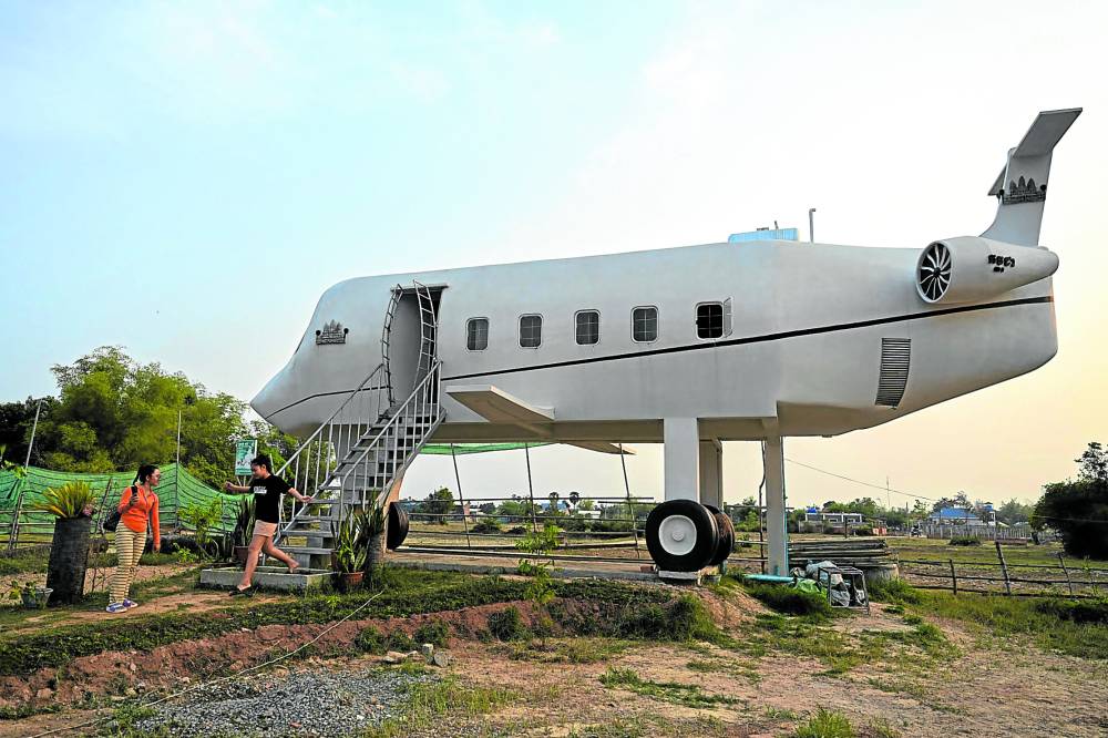 Visitors in Siem Reap, Cambodia,are charged a minimal fee if they want to take a peek into this “grounded” aircraft-shaped house, whose builder has yet to experience travelling on a real plane.