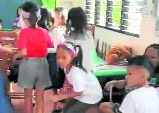Students in Masbate classroom as firefighting erupts nearby. STORY: 4 Masbate residents face murder raps due to NPA raids