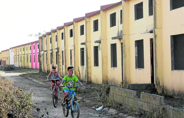 IDLE Units in a government housing project in Ibaan, Batangas, intended for policemen and soldiers have yet to be occupied when this photo was taken in 2020. —MARIANNE BERMUDEZ