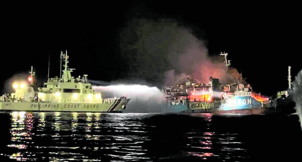 A Philippine Coast Guard ship tries to put out the blaze that swept through the MV Lady Mary Joy 3 which caught fire off Basilan province as it was sailing to Sulu on Wednesday night.At least 29 died and 17 were missing from the fire that reportedly started in an air-conditioned cabin in the lower deck. 