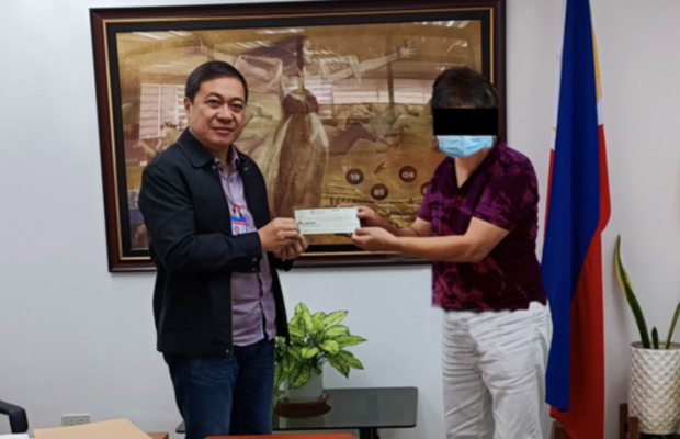 A 74-year-old cancer survivor claims his P50-million lotto prize at the Philippine Charity Sweepstakes Office at Mandaluyong City on March 3, 2023. (Photo courtesy of Ericson L. Delos Reyes)
