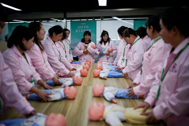 Chinese school trains women to take care of newborns