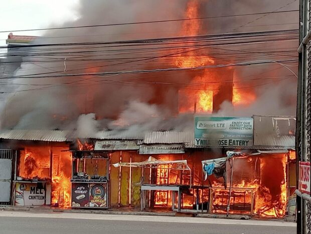 A fire razes a stretch of eateries and houses at Barangay Palanginan in Iba town, Zambales