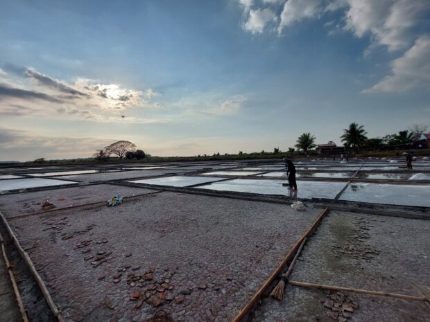 Pangasinan salt farmers say importation and unstable income are among their problems  