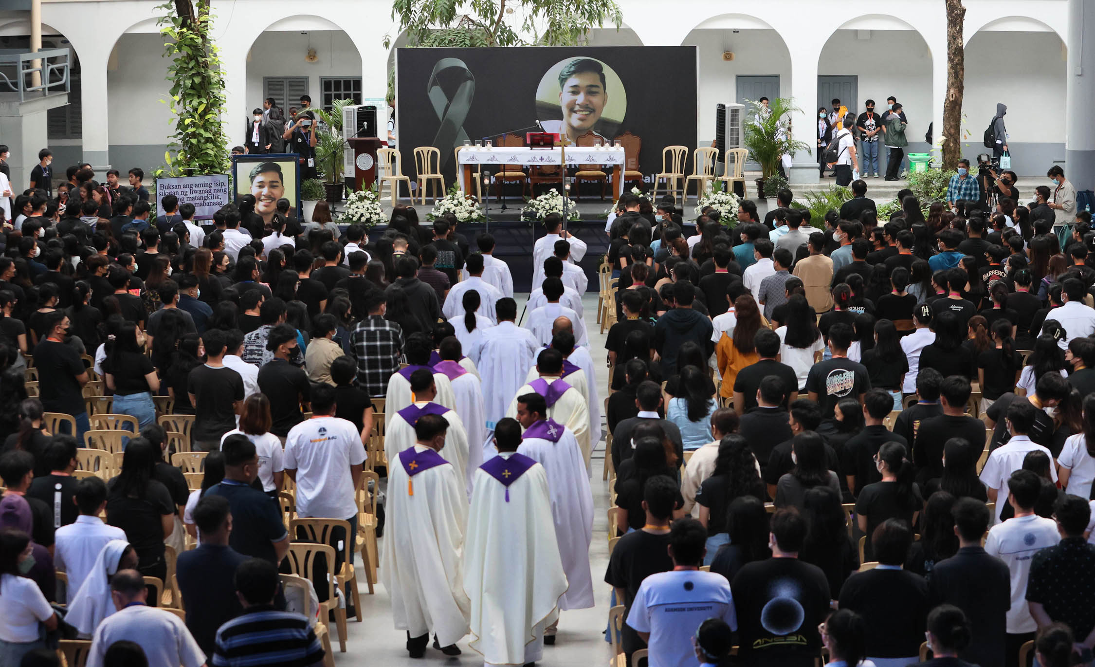 Hundreds of students and school officials of Adamson University in Manila attend a requiem Mass on Thursday for 24-year-old chemistry major John Matthew Salilig, who allegedlydied at the hands of his fraternity brothers in the Tau Gamma Phi last month