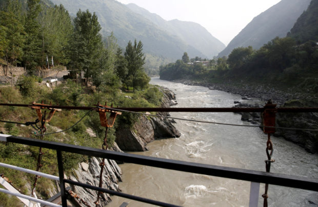 FILE PHOTO: Neelam river flows between Pakistan administered Kashmir and Indian administered Kashmir in Teetwal