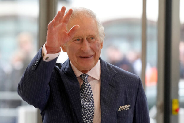 FILE PHOTO: Britain's King Charles waves as he arrives for a visit to the new European Bank for Reconstruction and Development (EBRD) in London