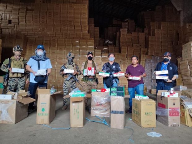 The composite team from the Customs Intelligence and Investigation Service at the Manila International Container Port (CIIS-MICP) led by its chief Alvin Enciso checked smuggled cigarettes from a raided warehouse in Indanan, Sulu on Thursday, March 2, 2023. The estimated value of the 19,000 master cases was P1.425 billion. 
